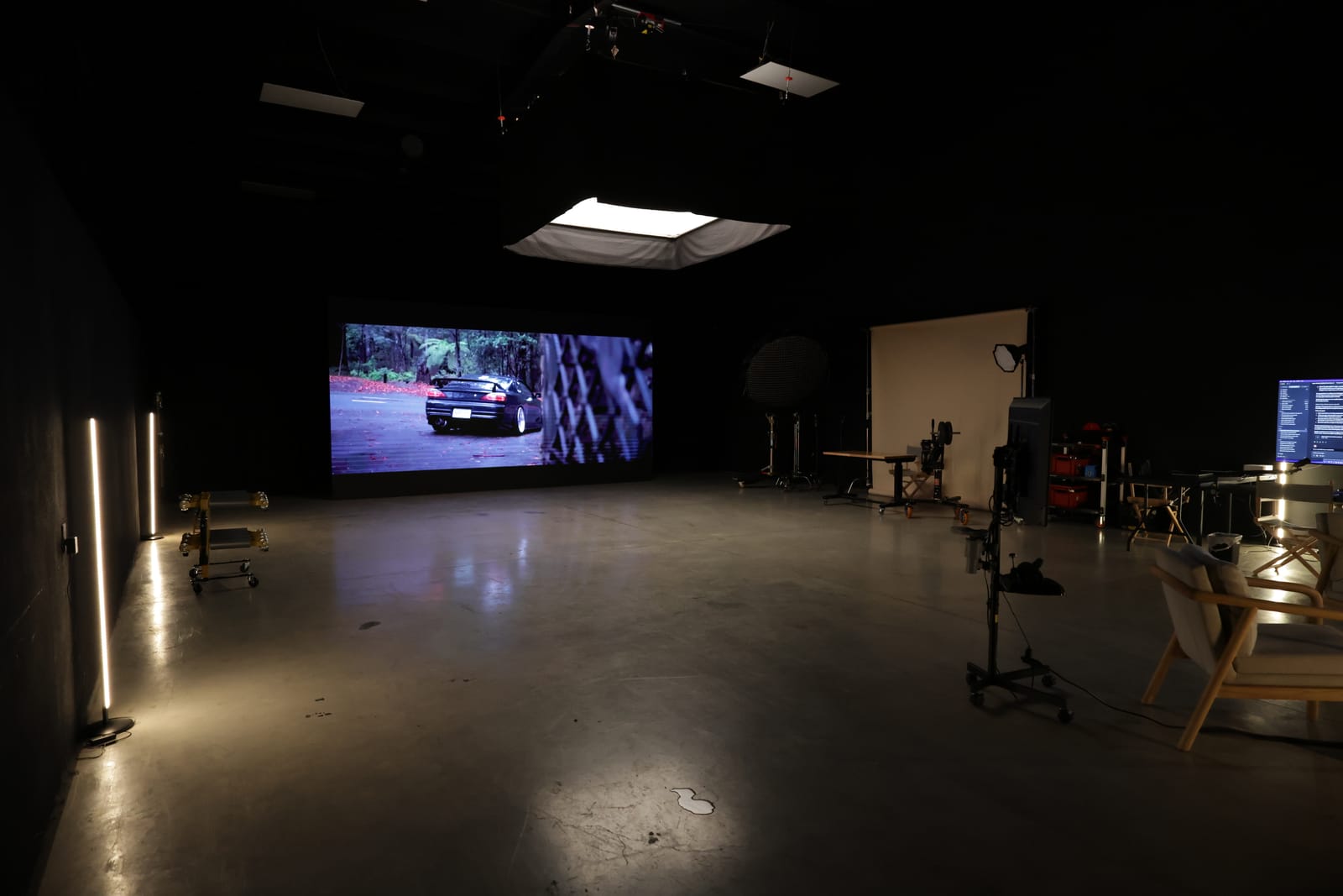The Asper Studios stage in Fort Worth, LED wall lit, grip and lighting gear staged across the floor